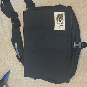 The North Face messenger bag. Never used.